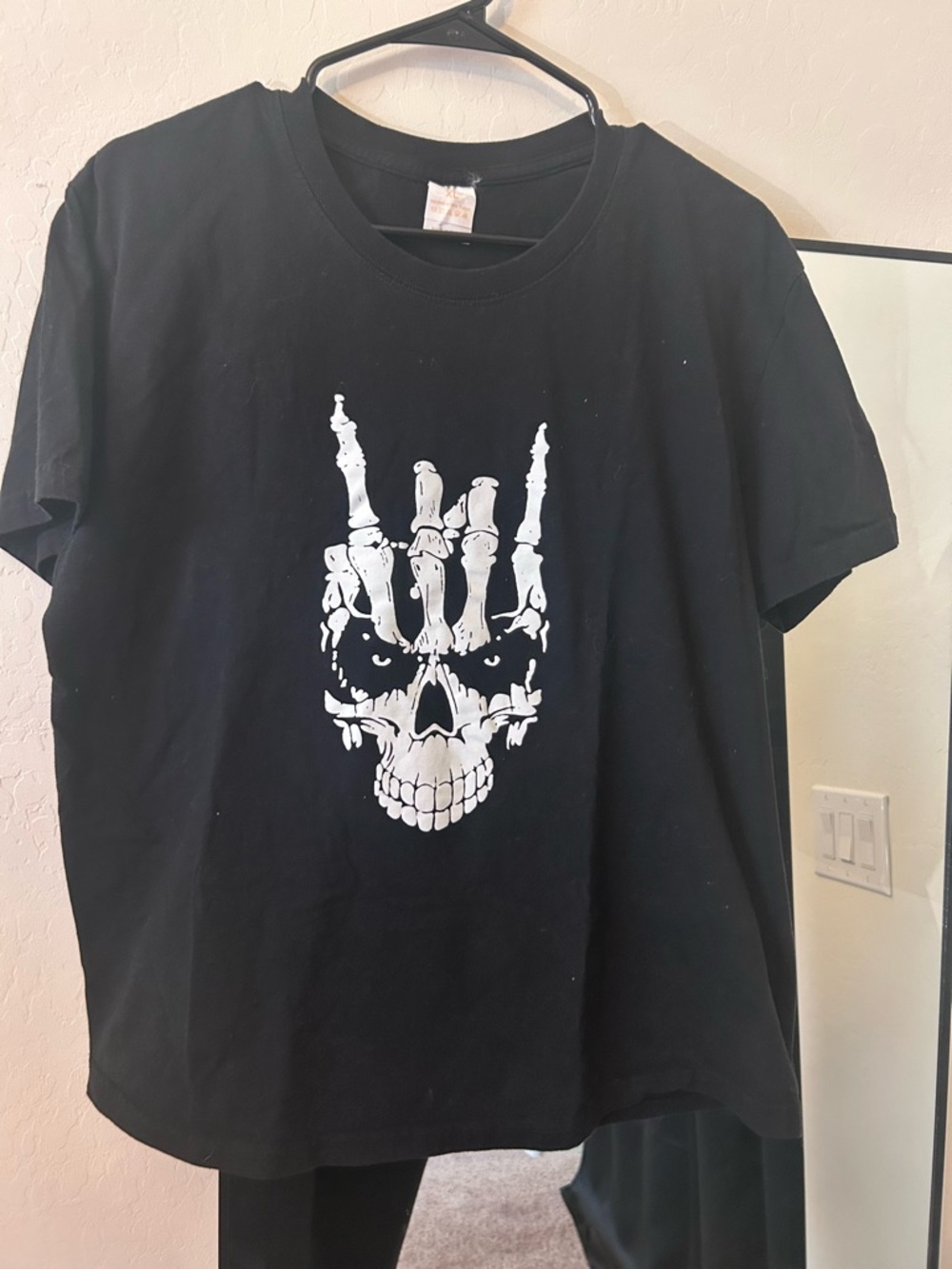 Black Skull Graphic Tee with White Skeleton Hand Design